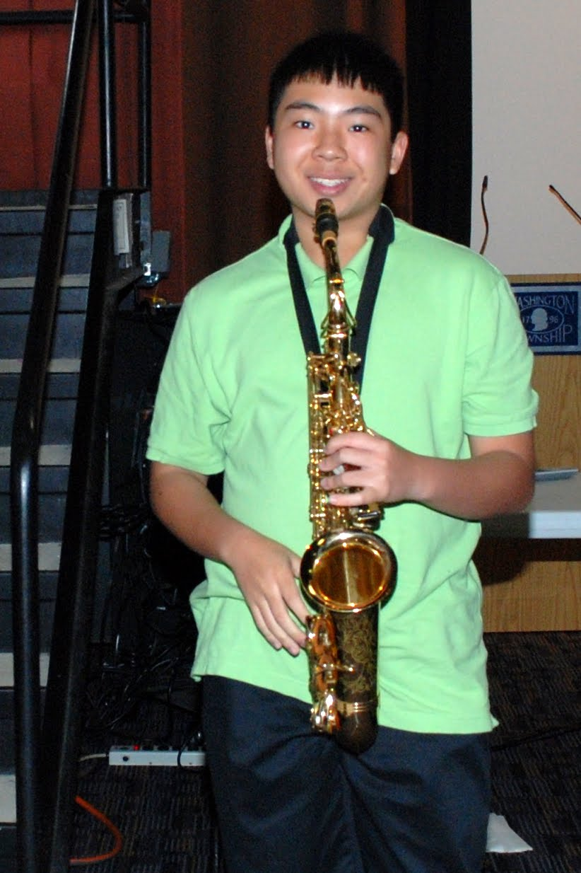A young performer on saxophone