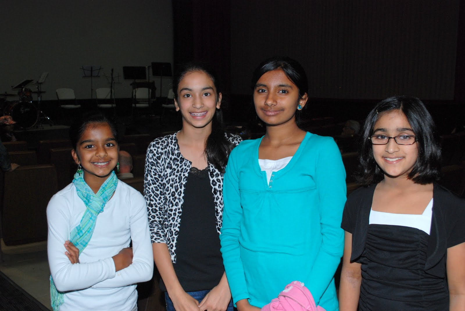 Four girls posing together before the show