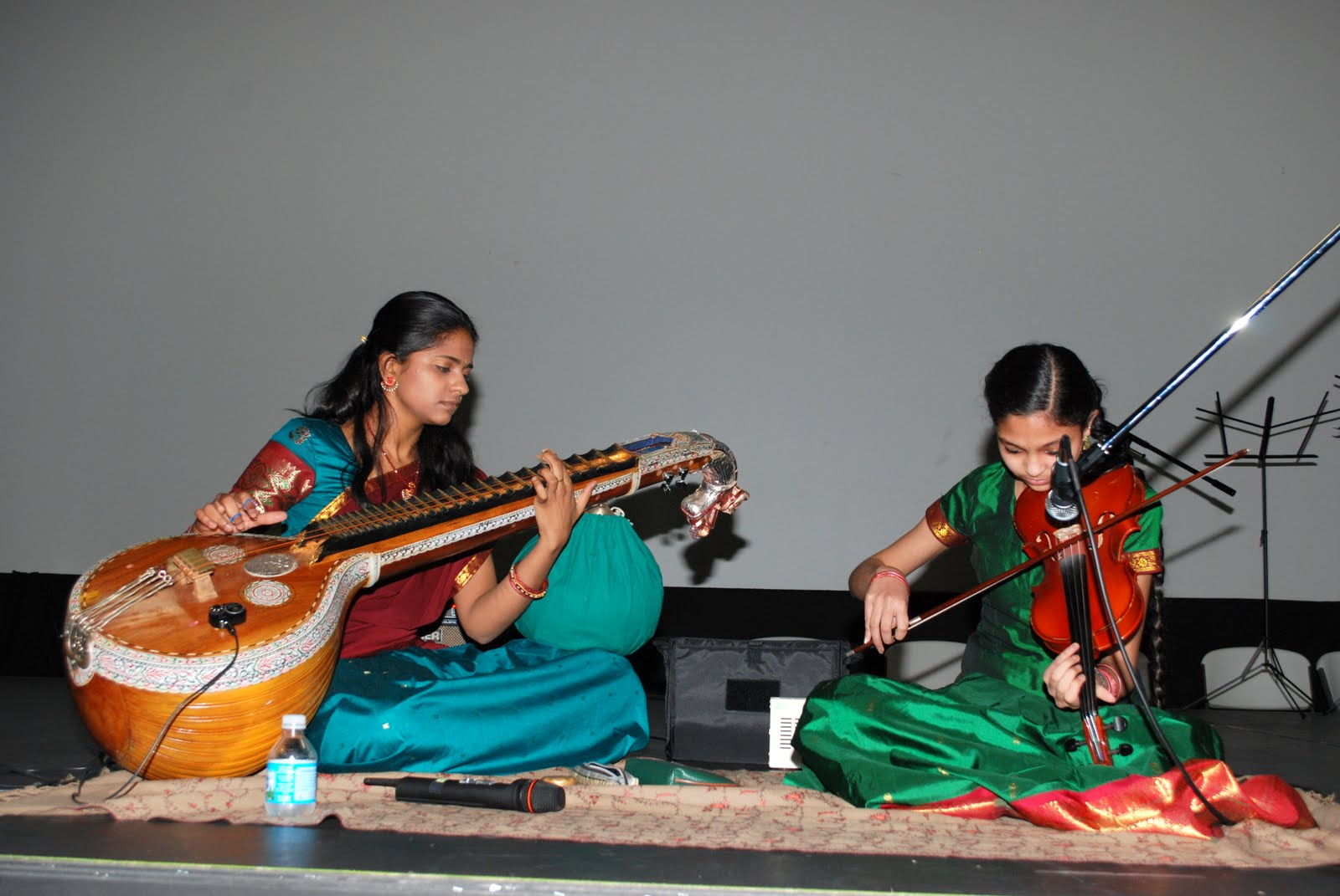 Two musicians playing sitar and tabla together