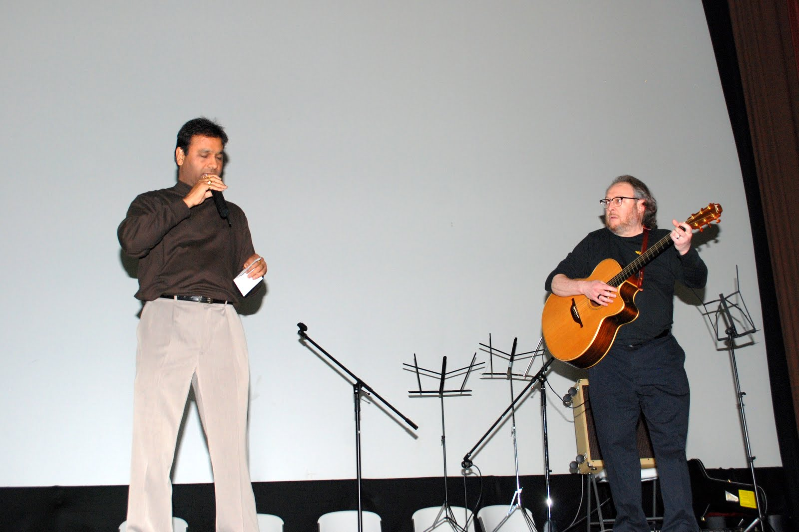 A guitarist accompanying a singer