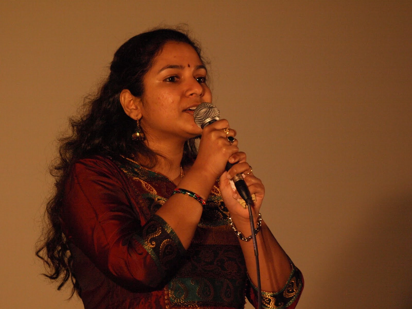 A woman singing into a microphone