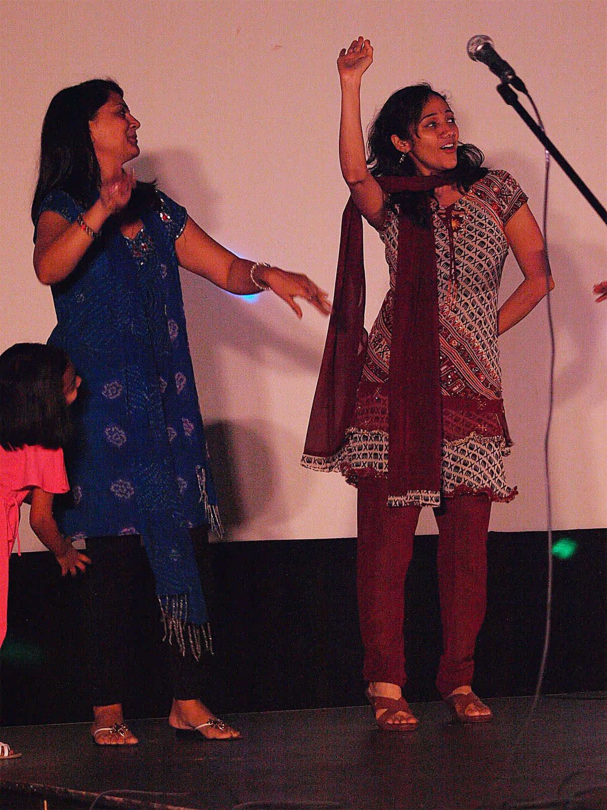 Two women dancing together on stage