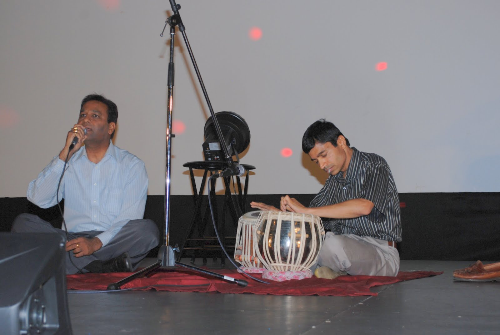 Two musicians playing tabla together