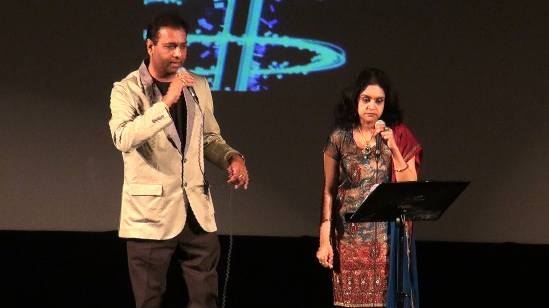 A man and a woman on stage together