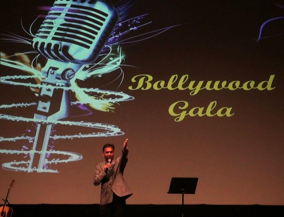 The Bollywood Gala backdrop with a saxophonist performing