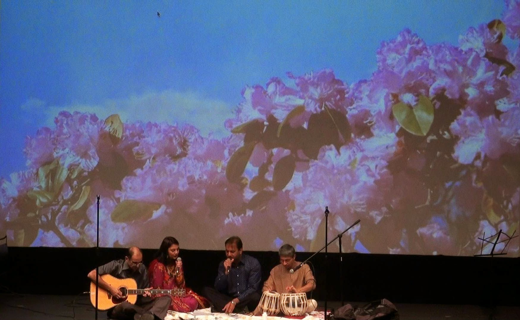 A guitarist and tabla player performing together