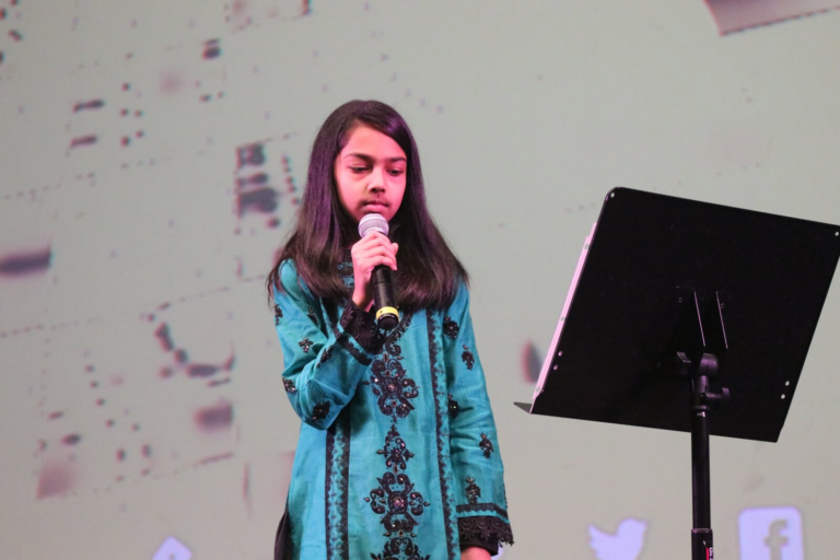 A young girl singing
