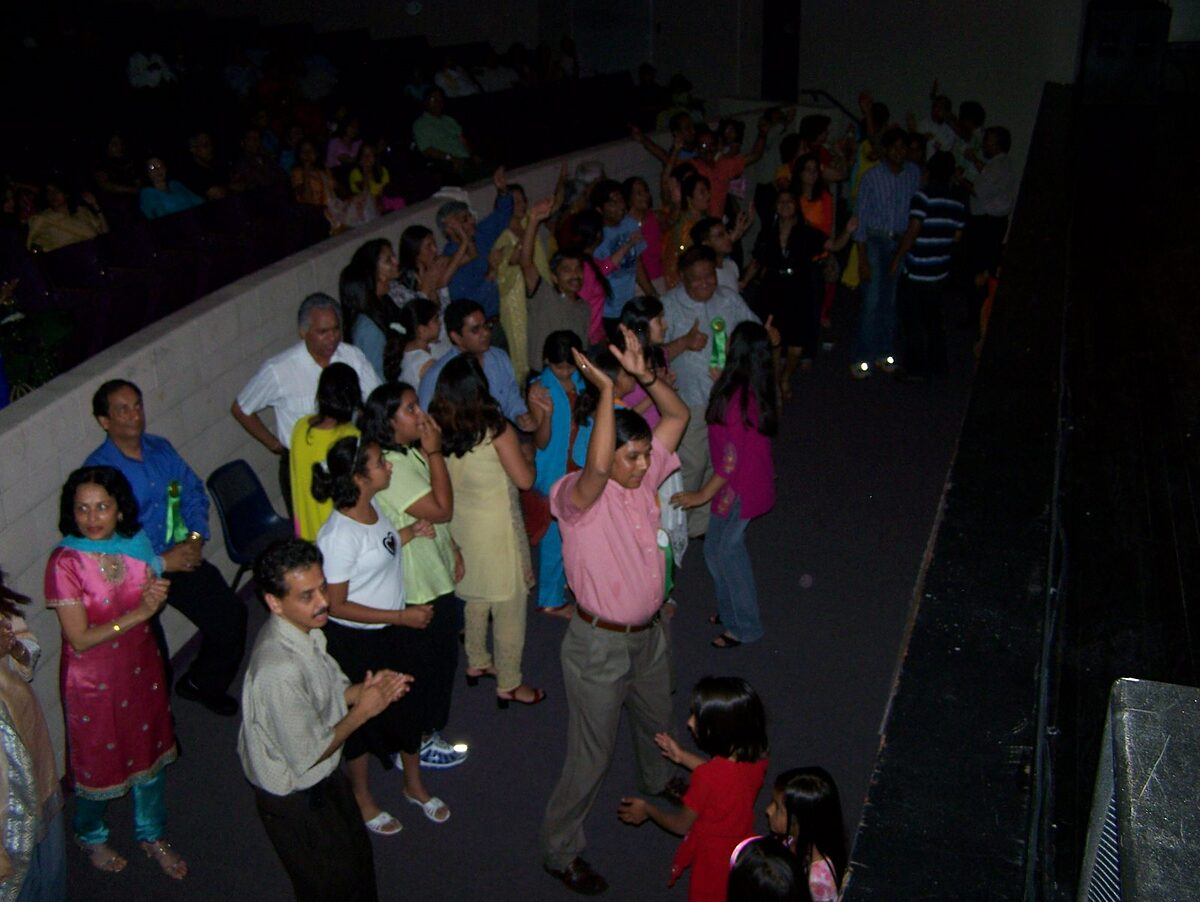 Families dancing together as the concert closes.