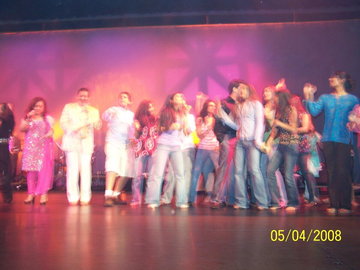 The full cast on stage for the finale.
