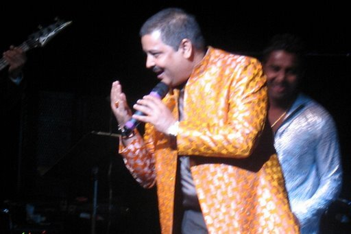 Udit and Aditya Narayan sharing the stage.