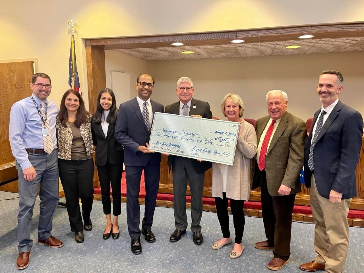 Hemant and Arti Garg presenting a check to the Washington Township Trustees for the RecPlex water feature