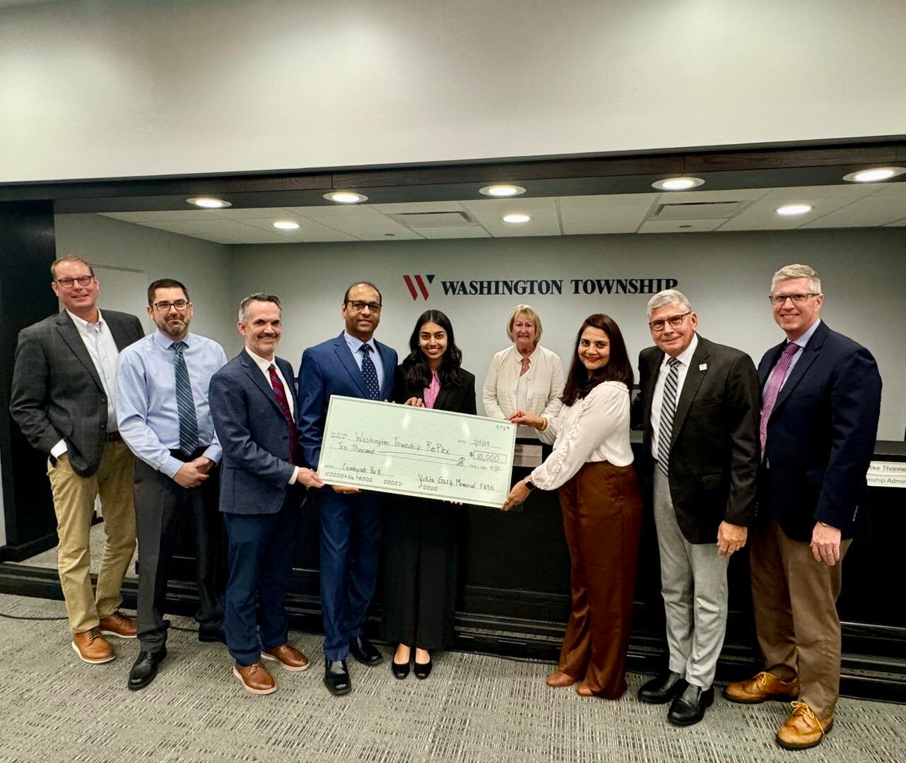 Hemant and Arti Garg presenting the 2024 check to the Washington Township Trustees