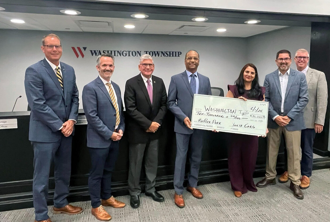 Washington Township Trustees and staff with Arti and Hemant Garg presenting the $10,000 check reaching a cumulative $100,000 milestone